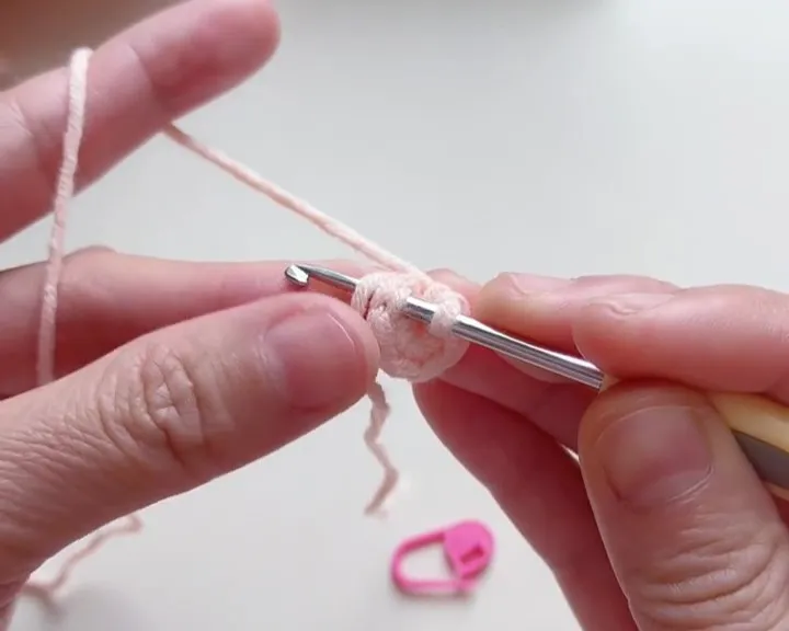 Lay the yarn tail over the hook to hide the tail as you crochet. Lay the yarn tail over the hook to hide the tail as you crochet.