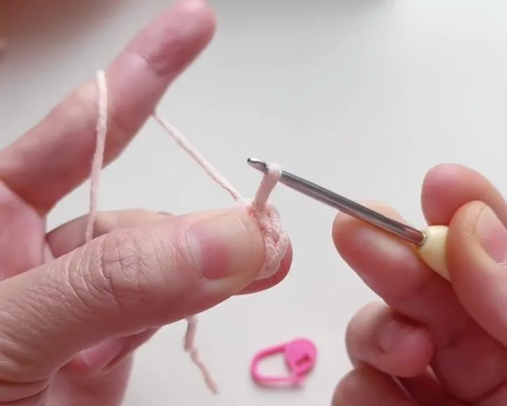 Make one slip stitch, then pull tight to close the ring. Make one slip stitch, then pull tight to close the ring.