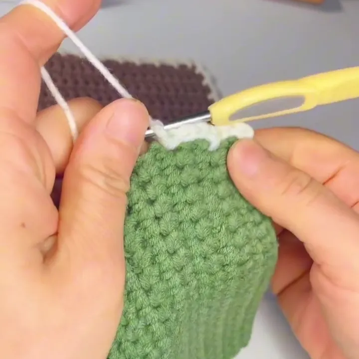 Repeat the Edging Pattern Continue working the edging using the same simple pattern all the way around the square.The edging repeat is:Chain 3Slip stitch into the next stitchRepeat chain 3, slip stitch evenly along the edge.