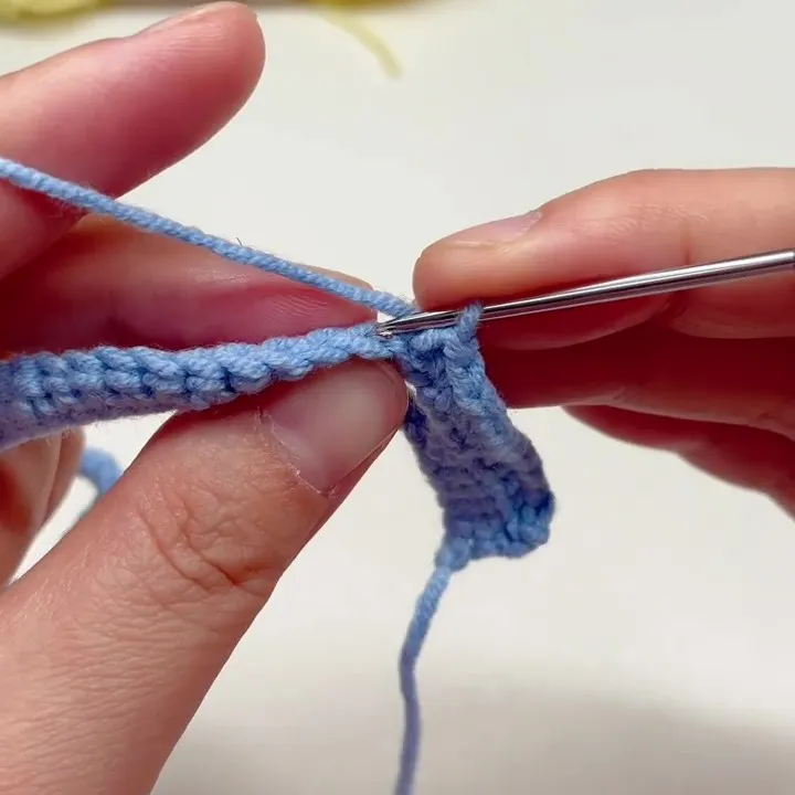 Single Crochet in the Back Loop Only (BLO) Crochet hook inserting into the back loop only while working single crochet stitches