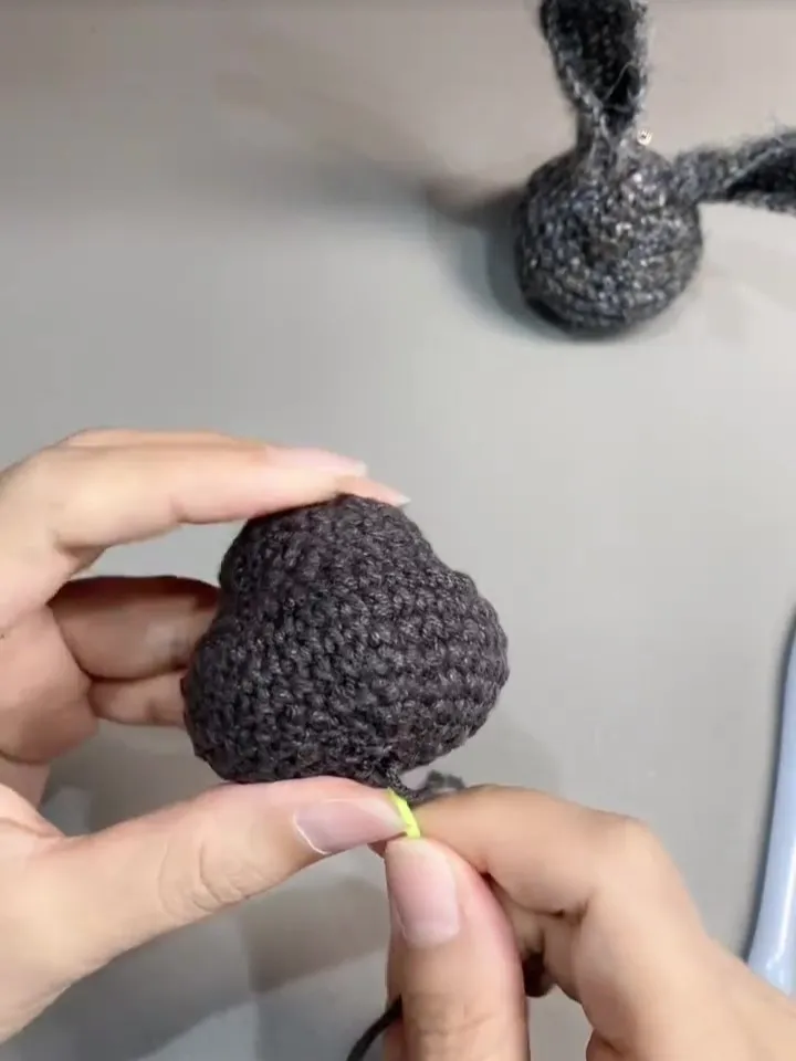 crochet bunny head showing the rounded shape before finishing