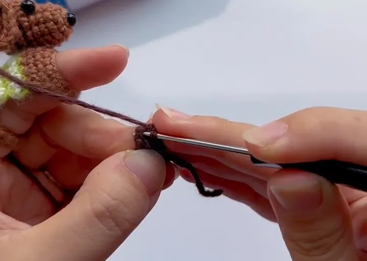 crocheting the tiny ear for a crochet dachshund finger puppet