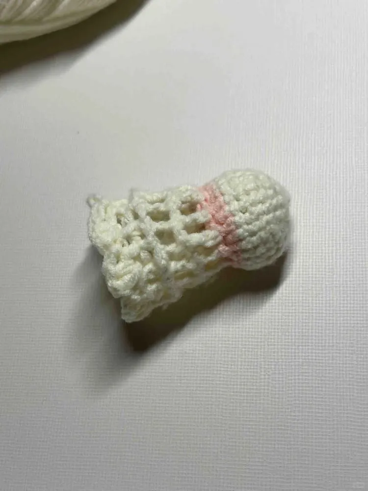 How to Crochet a Mini Shuttlecock Keychain (Easy Beginner Pattern) 7 crochet shuttlecock back side pulled inward due to incorrect stitch insertion