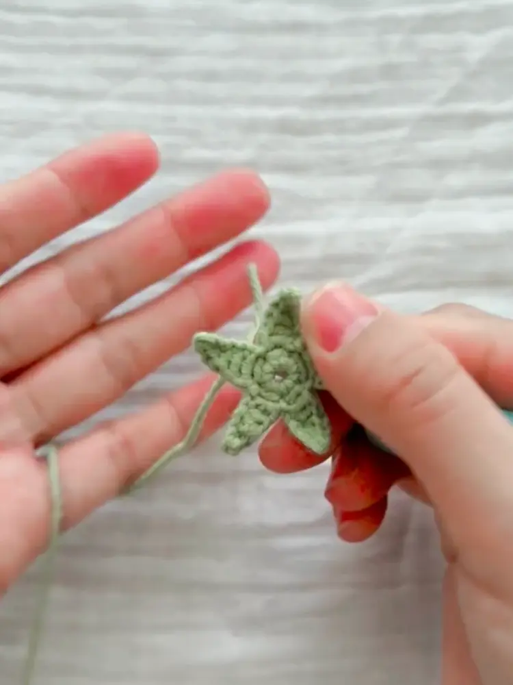 Tiny Crochet Tomato Pattern: A Quick 5-Minute-Style Project for Beginners 2 Green crochet tomato leaf top with five points before being sewn onto the tomato body