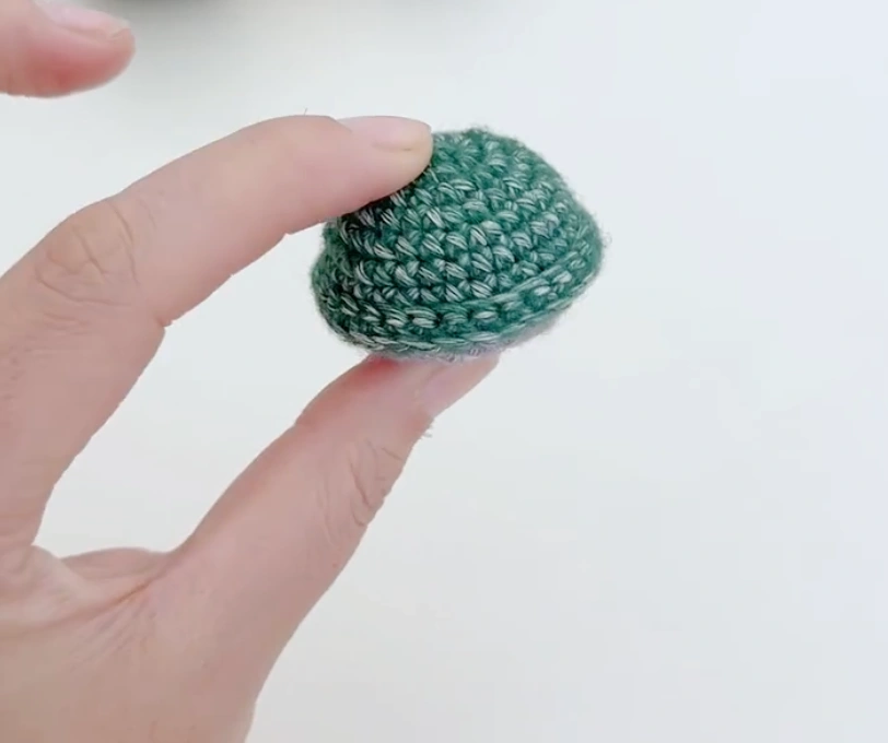 Mini Crochet Turtle Pattern for Beginners: Tiny Amigurumi Turtle 2 Finished green crochet turtle shell with a rounded top and small raised edge