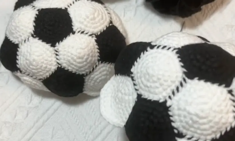 Mini Crochet Soccer Ball Pattern: The Layout Is the Real Trick 5 Two crochet soccer ball halves made from black pentagons and white hexagons